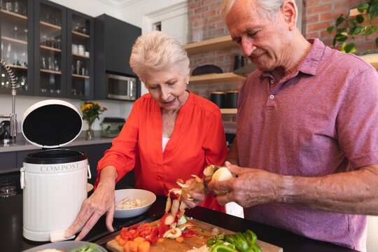 Caucasian senior couple cooking together at home