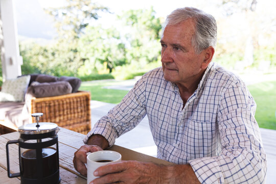 Caucasian Senior Drinking Coffee At Home