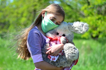 Protection from the flu. Allergy. A little girl in a mask during the pandemic virus.