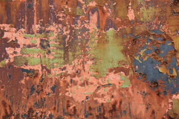 Rusty, orange surface of weathered iron plate, machine.