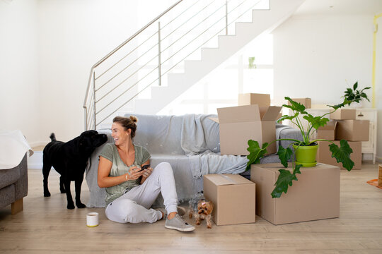  Woman in Social Distancing using her smartphone at home