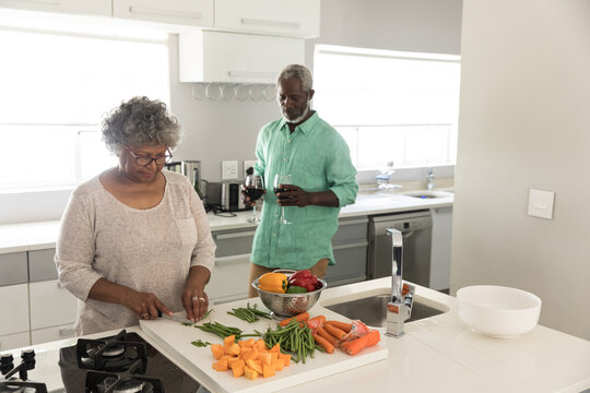 An African American couple spending time together at home and cooking