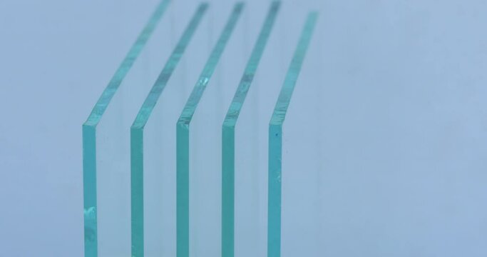 Sheets of Factory manufacturing tempered clear float glass panels cut to size.