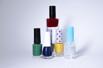 Bottles with nail polish on white background. nail lacquer. Nail manicure concept. Isolated, copy space.