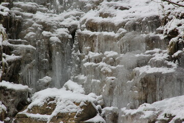 Frozen water, waterfall in the nature. Cold winter day.