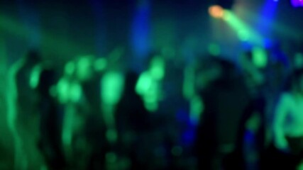 blurred silhouettes of a crowd of people dancing on the dance floor in a nightclub - Powered by Adobe