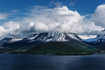 Mountain with it's peak hidden in the clouds. Alesund, Norway