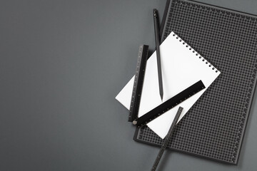 Designer’s, architect's or student's desktop with pencil, binder notepad, measuring rulers. Set of measuring equipment and stationery. Concept of work or education.
