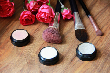 Obraz na płótnie Canvas decorative cosmetics, eye shadow, lipstick a makeup brushes