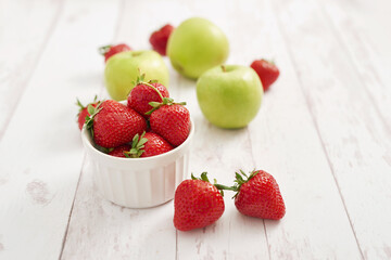 Detox concept. Tasty fruits and berries. Healthly food. Veganism, vegetarianism, raw food diet. Strawberries and apples. Summer fresh fruits. Copy space. Vitamins in food. Healthy breakfast