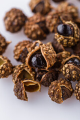 fragrant Sichuan pepper on white acrylic background