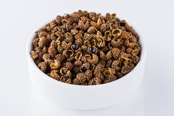 fragrant Sichuan pepper on white acrylic background