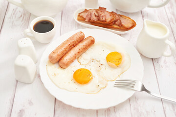 Healthly food. Continental breakfast in hotel room or bed. Fried eggs with sausages. Cup of coffee. Menu template. Cookery. Cooking. Romantic french or rural breakfast on Valentine.