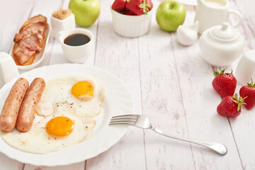 Healthly food. Continental breakfast in hotel room or bed. Fried eggs with sausages. Cup of coffee. Menu template. Cookery. Cooking. Romantic french or rural breakfast on Valentine.