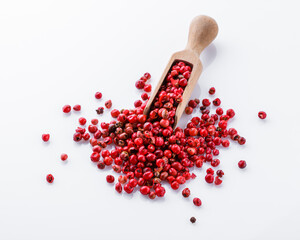 fragrant pink peppercorns on white acrylic background