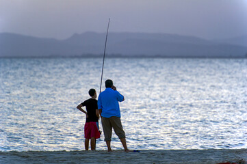 Tunisia, Cap Bon. Hammamet. Fisherman and his son