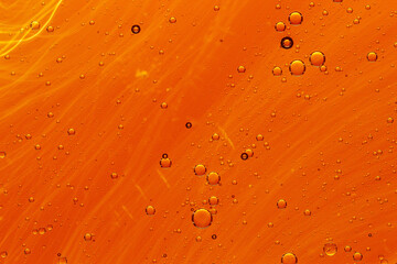 Abstract colorful background with oil drops and waves on water surface