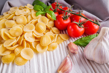 concept of traditional italian pasta with tomatoes and basil