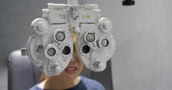 Woman check her eye at clinic