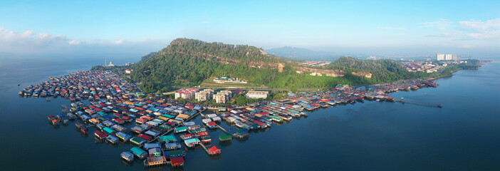 An aerial Panoramic view of local water village houses at Sandakan. Sandakan once known as Little Hong Kong of Borneo - obrazy, fototapety, plakaty