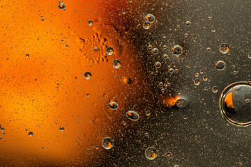 Abstract colorful background with oil drops and waves on water surface