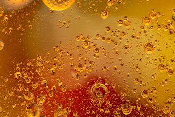 Abstract colorful background with oil drops and waves on water surface