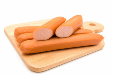 Hot Dog sausages on cutting board isolated on white background