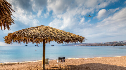 tropical beach with umbrella