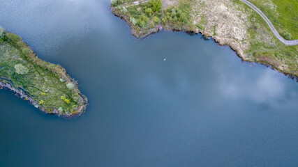 amazing aerial view of green island and blue water. drone shot. natural summer background