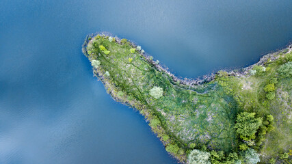 amazing aerial view of green island and blue water. drone shot. natural summer background