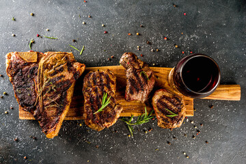 Set of various grilled meat, different beef steaks with sauces.Bbq beef steaks - chateau mignon,...
