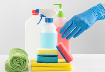 set of detergents and cleaners for cleaning rooms on a white background