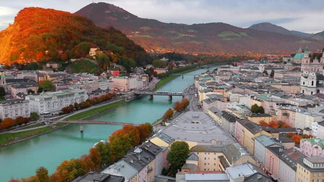 Attractive evening cityscape of Salzburg, Old City, birthplace of famed composer Mozart. Aerial autumn scene of  Eastern Alps.Splendid  landscape with Salzach river. Full HD video (High Definition).
