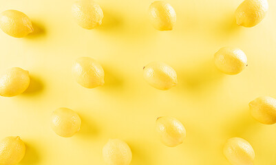 Top view of fresh lemon on pastel yellow background. Food concept. Flat lay, top view.