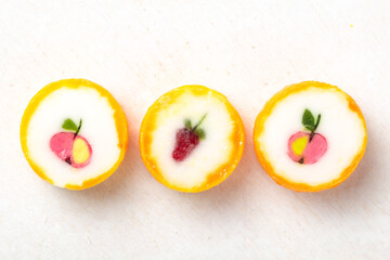 Three different colorful bright unwrapped round lollipops