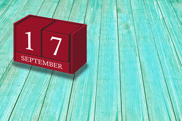 September 17th, Day 17 of September month, Red calendar on workplace green wood, Empty space for text, Copy space right, 3D illustration