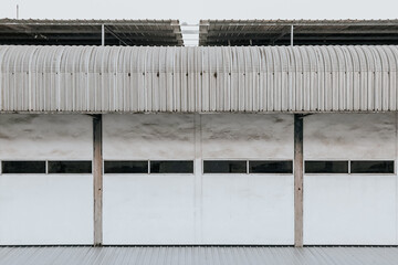 The pattern of the white wall of the building