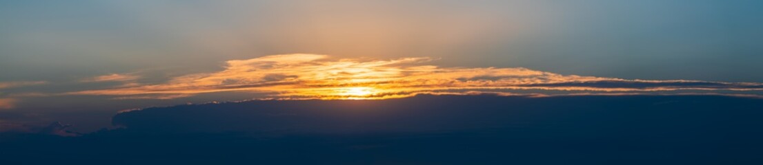 Wide panorama of beautiful colorful sunset sky