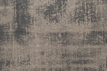 Rustic background with canvas texture with with spots of gray paint