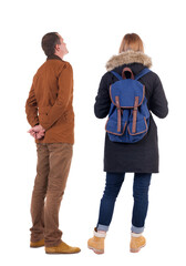 Back view of couple in winter jacket.