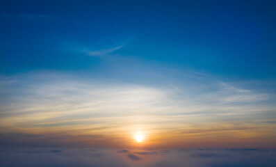 Yellow and blue dawn over clouds, concept, travel and leisure.