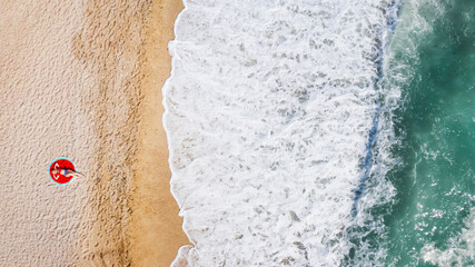 Fototapeta na wymiar Aerial view of a girl on the beach. Summer time