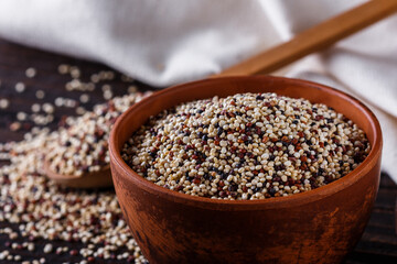 mix of quinoa grains on dark wooden rustic background