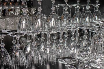 A lot of glass goblets. Glass, tableware for alcohol.