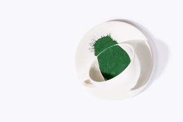 Organic green spirulina chlorella algae powder on white background