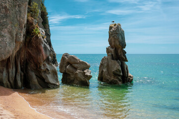 View from the beach of rocks formations in Abel Tasman on a sunny day