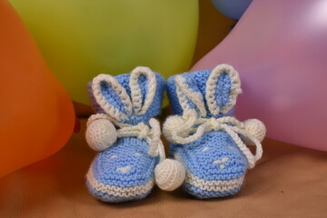 Fototapeta na wymiar children's hand-made knitted shoes