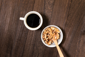 Delicious walnuts, coffee and an atmospheric backdrop.