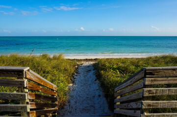 View of the ocean from a wooden deck in the Key, Florida, on a sunny day