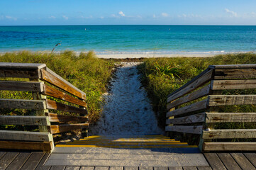 View of the ocean from a wooden deck in the Key, Florida, on a sunny day